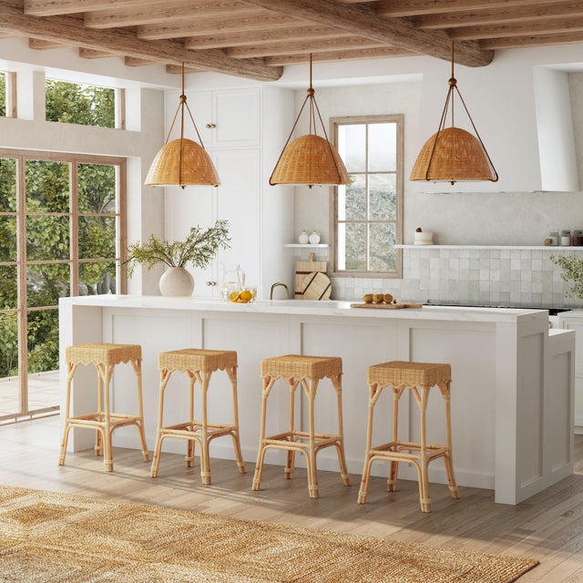 Elevate your space with our Butler Specialty Company Flora natural rattan bar stool. Crafted with love, its hand-woven...