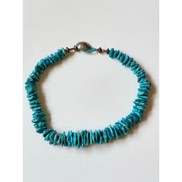 From an estate of a collector of Native American jewelry, this necklace is a stunner! Graduated turquoise chunks set off...