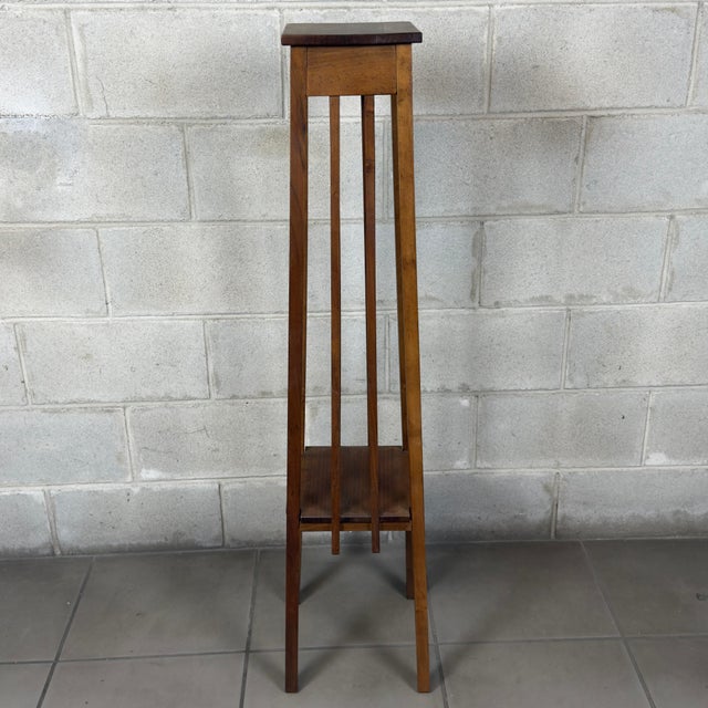 A display pedestal with a clean-lined, distinctly vertical design, attributed to an Italian manufacturer from the early...