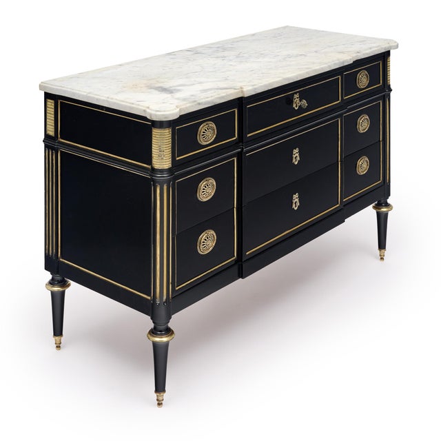 French chest of drawers or commode in the Louis XVI style. This chest is made of solid wood construction, primarily...