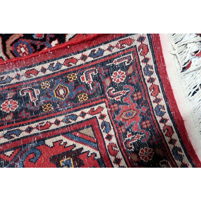 A handmade vintage Persian Hamadan rug from the 1940s, woven in wool and showcasing the bold geometric character typical...
