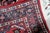 A handmade vintage Persian Hamadan rug from the 1940s, woven in wool and showcasing the bold geometric character typical...