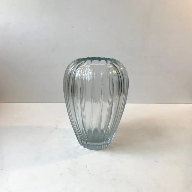 Important piece of Swedish art glass history. A Triton vase in vaguely blue tinted clear, multi-faceted, beveled and...