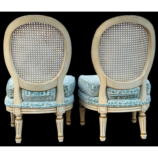 This is a pair of Hollywood Regency Era Italian slipper chairs newly upholstered in a cut velvet. The frame is an ivory...