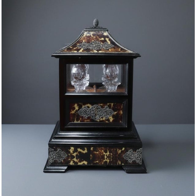 Gorgeous fine faux tortoiseshell veneered and silver-mounted tantalus, of pagoda form, the hinged lid with acorn finial...