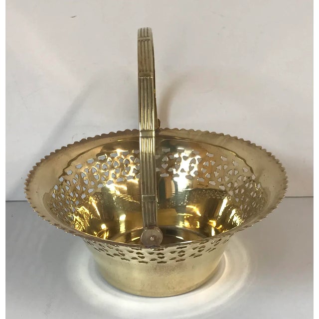 Nice vintage pierced edge brass basket with movable receded handle.could be used as a planter for a floral arrangement