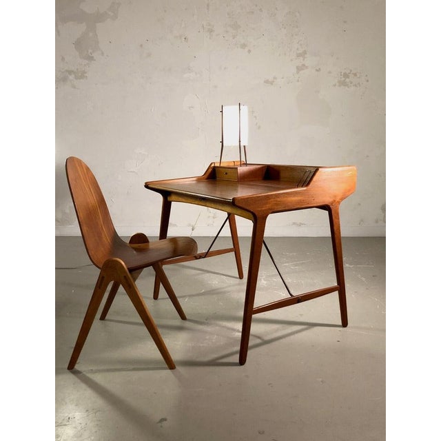 An elegant and aerial Small office or system secretary, modernist, libre-shaped, dansk, Scandinavian, teak structure with...