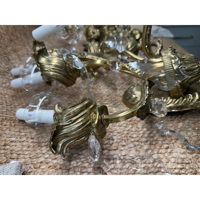 Elegant pair of six-light brass wall sconces by Preciosa-Lustry, Kamenický Šenov, Czech Republic. Each features richly...
