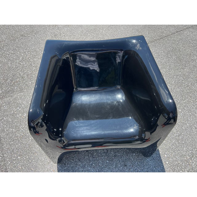 Spirit of 1960s Italian modern design. Sculptural and architectural in form, this chair features a fluid, monolithic...