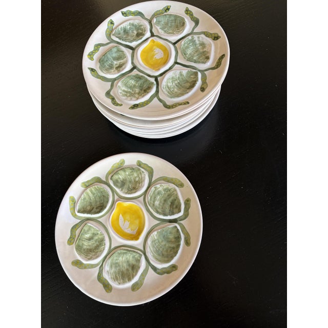 The "Belon" oyster plate from the Faiencerie de Pornic (MBFA) is a vintage hand-painted ceramic dish featuring...