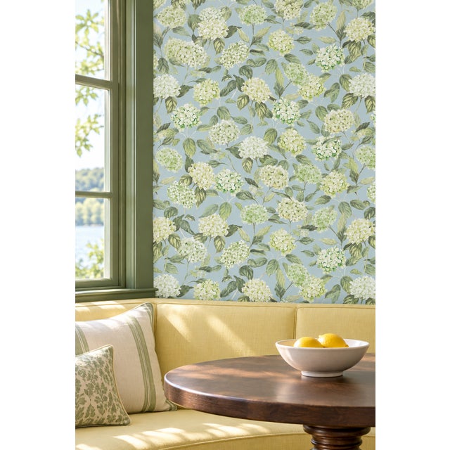 Our Hydrangea Blooms Botanical Wallpaper began as a hand-painted watercolor, with each petal added one by one to capture...
