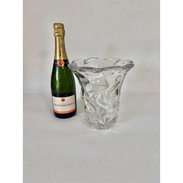 This is a very thick crystal vase, made of art glass, and very heavy. It was made in France in the 1970s.