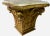 Add a classic touch to your decor with this fine wooden Corinthian capital table with a gold finish and fine marble top....