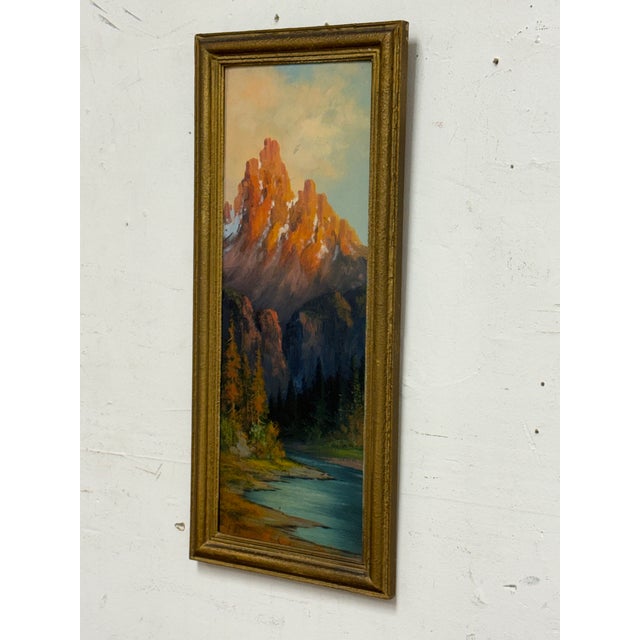 Design Plus Gallery presents a Vintage Framed Mountain Landscape Oil Painting. This vintage framed oil painting depicts...