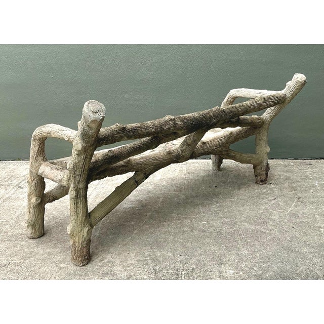 Crafted in cement, this vintage faux bois garden bench captures the rustic charm of natural wood through meticulous...