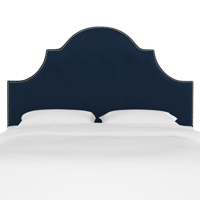 Classic curves wrapped in smooth upholstery, then accented with elegant ornamental nailheads, gives this Upholstered...