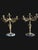 A pair of finely chased gilt bronze candelabra resting on circular bases of veined black marble. each stem is adorned with...