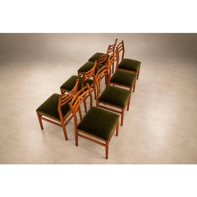 Produced by Móveis Arrendamento in 1960s Brazil, this set of twelve dining chairs brings together precise woodworking,...