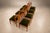 Produced by Móveis Arrendamento in 1960s Brazil, this set of twelve dining chairs brings together precise woodworking,...
