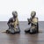 Pair of hand-carved teak Buddhist monk figures from Thailand, each depicted seated in a different pose. Finished in...