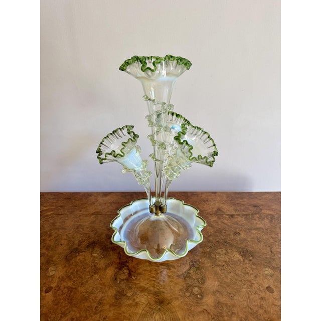Quality antique 19th century Vaseline and green glass epergne, having a quality Victorian glass epergne with one tall...