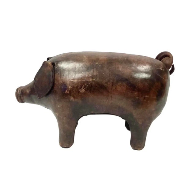 Vintage brown leather upholstered pig crafted by Omersa & Co. (Lincolnshire, UK), probably for Abercrombie & Fitch, with...