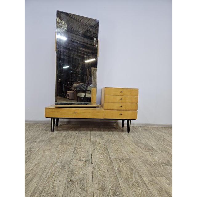 Dressing table from the 1960s. High-quality birch veneer body with rotating gloss, four drawers and storage under the...