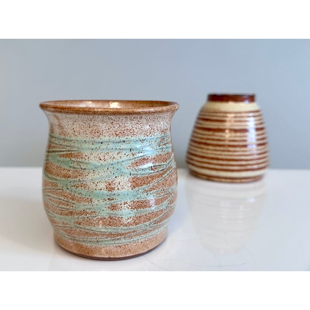 This pair of hand-thrown vases by ceramicist Helma Klett (1908-1996) showcases two of her characteristic decorative...