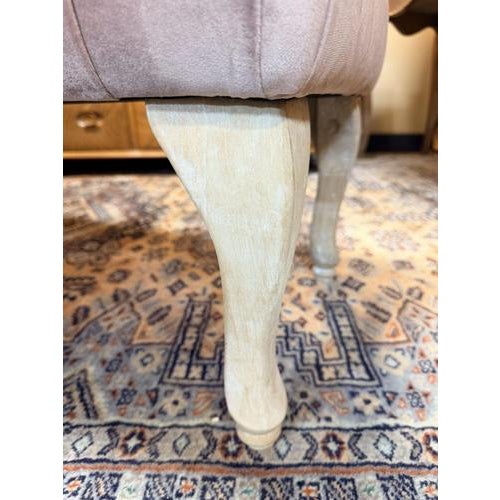 An elegant and timeless bed-end bench featuring beautifully carved, distressed cabriole legs. Upholstered in a soft,...