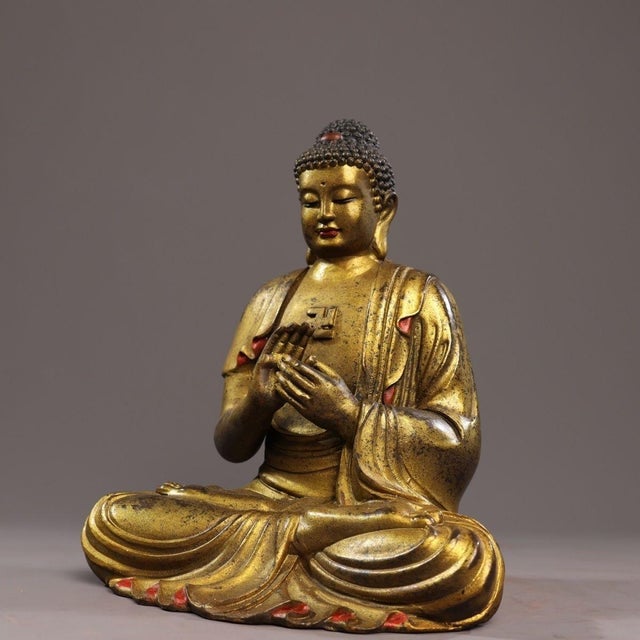 This magnificent vintage statue depicts Shakyamuni Buddha seated in the full lotus position, exuding a sense of profound...