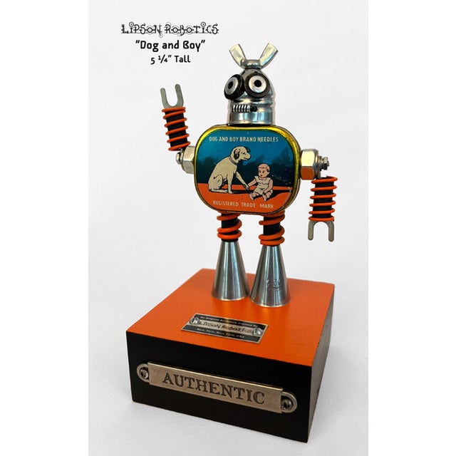 This mixed media assemblage features a whimsical figure combining mechanical elements with playful charm, depicting a dog...