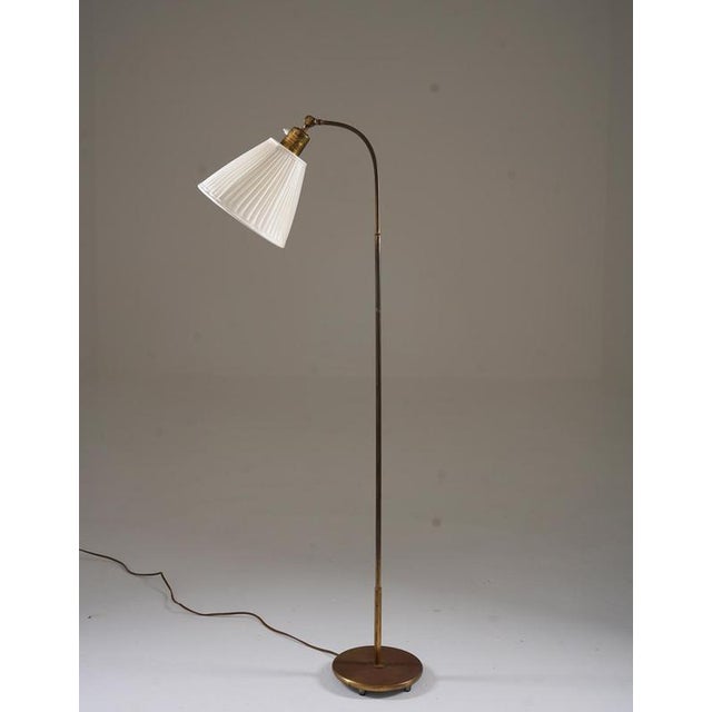 A refined 1940s floor lamp produced by nordiska kompaniet, showcasing the era's exquisite craftsmanship and understated...