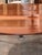 Directoire mahogany drop leaf table with an oval top and one additional leaf, on turned tapered legs ending in brass cup...