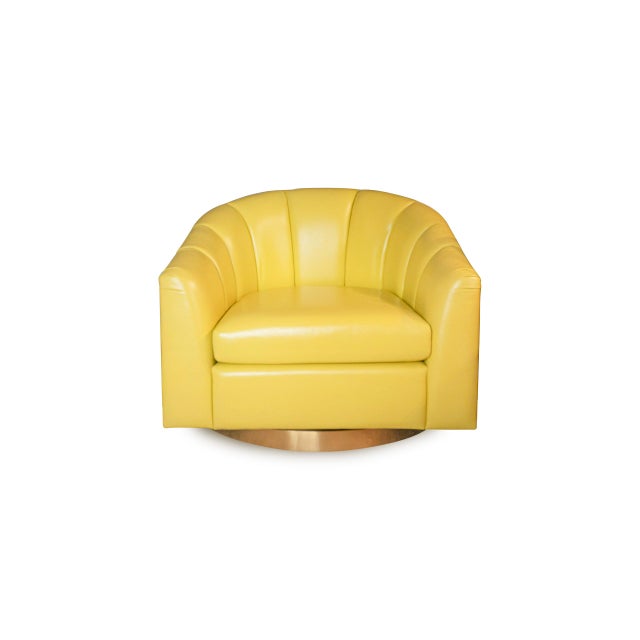 Super smooth luxurious leather chartreuse Italian leather swivel channel back chair on a gold swivel base. Swiveling is...