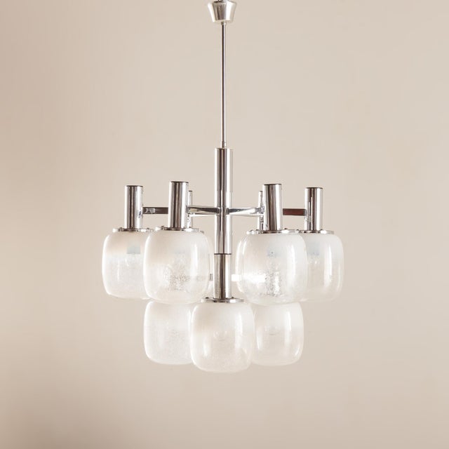 This Italian mid-century chandelier by Targetti Sankey, gives a fountain of beautiful warm light. It was manufactured some...