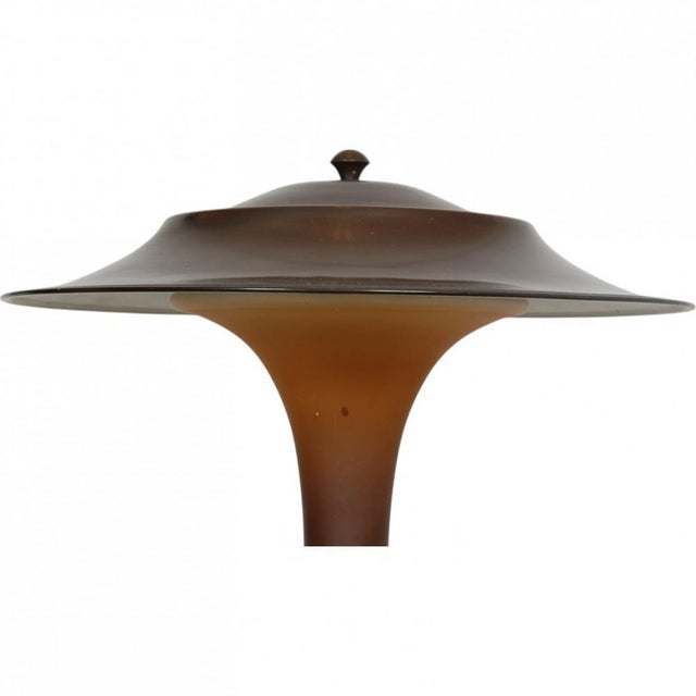 Fog and Mørup Torch lamp, designed in the 1930s. The lamp base and shade are made of brass with patina, and the pillar of...