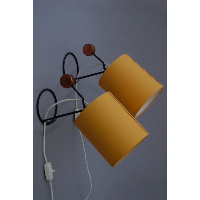 A pair of Wall / Table lamps Model number 26 by AJH, Sweden from the 1950s. Steel wired circular base and stems present a...