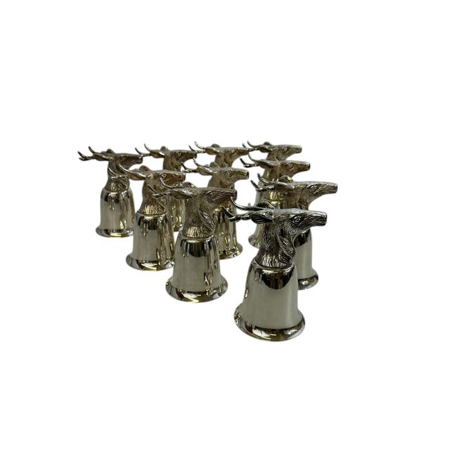 Set of 10 Silver Plate Elk Stirrup Cups A striking set of ten silver plate stirrup cups, each topped with a finely modeled...