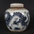 Beautiful Chinese chinoiserie lidded ginger jar decorated with a bold hand‑painted blue dragon motif against creamy white...