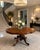An antique Victorian figured mahogany dining and centre table with an unusual serpentine-shaped top and a beautifully...