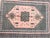 Beautiful midcentury Moroccan rug with a geometric design with central medallion and stylized flowers and a pink field...