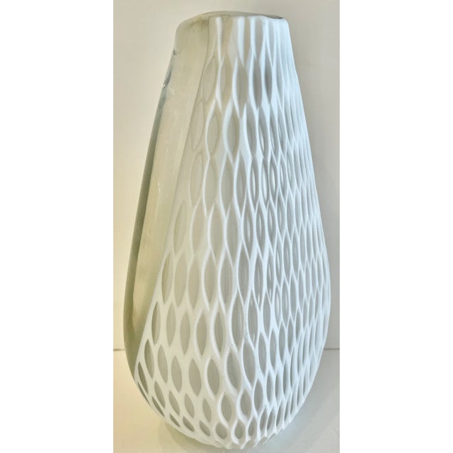 Beautiful glass vase in white and clear. Irregular textured lace pattern. Light general wear. No chips.