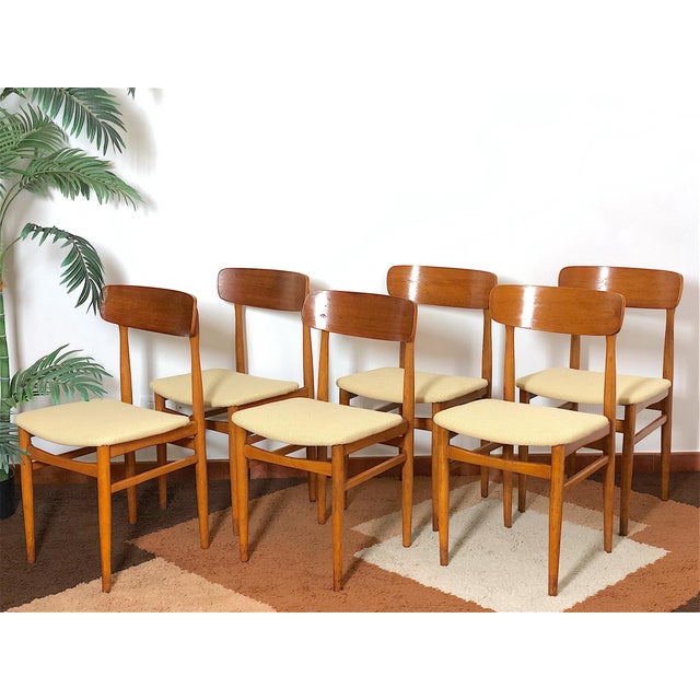 Set of 6 Vintage 1960s Chairs. The chairs are Italian-made, with a solid beech wood frame and a warm, natural finish that...