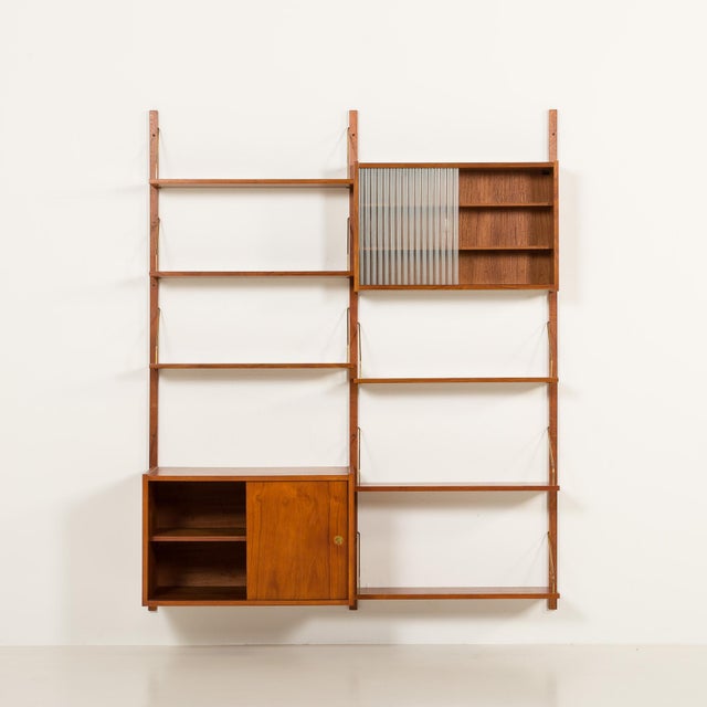 This elegant danish teak wall unit was made in the 1960s, in randers, denmark. It's a part of the modular ps system...