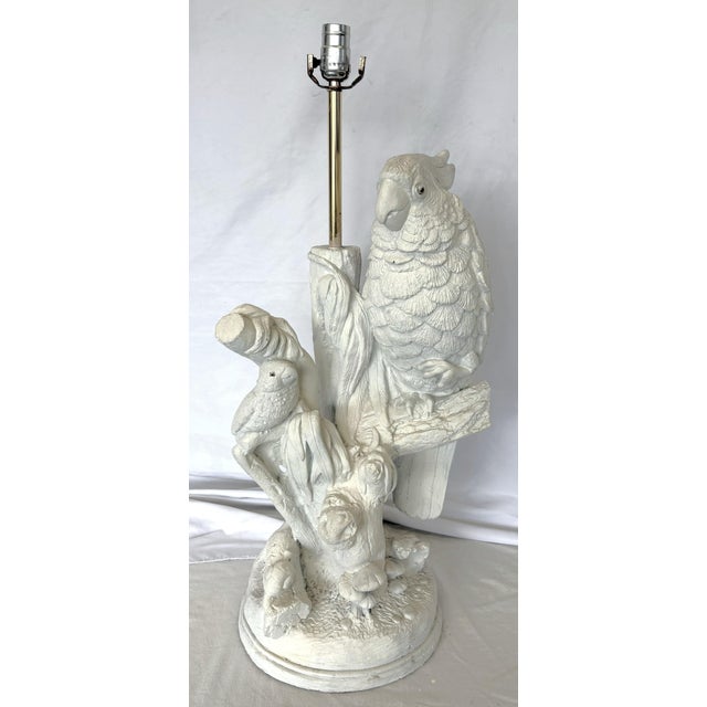 Fun tropical bird table lamp from the 1970's. The mid-century modern coastal piece depicts tropical birds, snails, and...