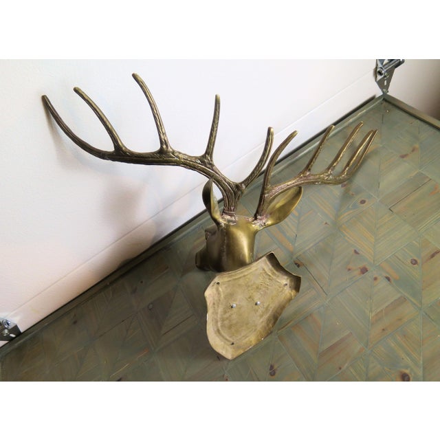 This 10 point brass deer head sculpture recreates nature at her finest. It lays flat against a wall surface and adds a...