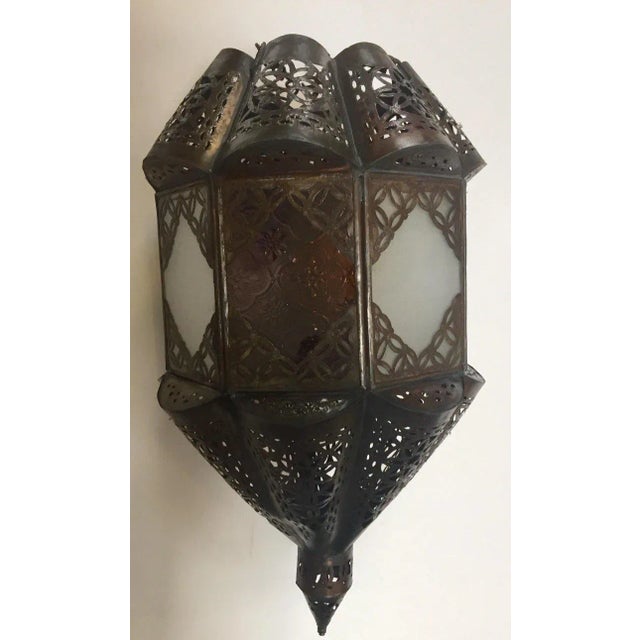 Stylish handcrafted Moroccan lantern pendant with frosted milky glass and multi-color molded glass. Handmade with small...