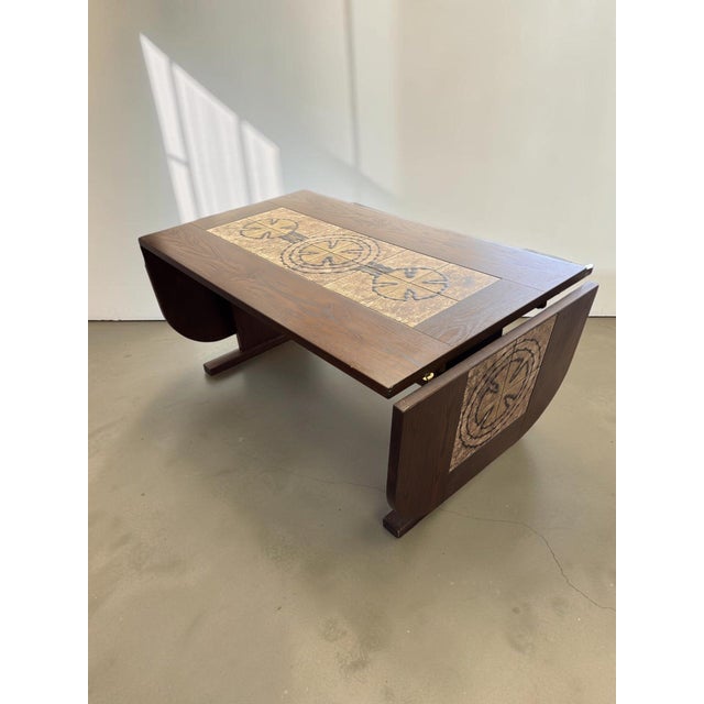 A truly impressive piece: this Danish dining table by Poul Poulsen for Gangsø Møbler. The tabletop features an inlay of...