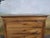 Antique Fruitwood Chest of Drawers with Four Drawers An elegant antique chest of drawers in solid walnut, displaying a...