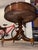 This elegant vintage drum table, crafted from rich mahogany, is a classic example of the traditional Federal or Georgian...